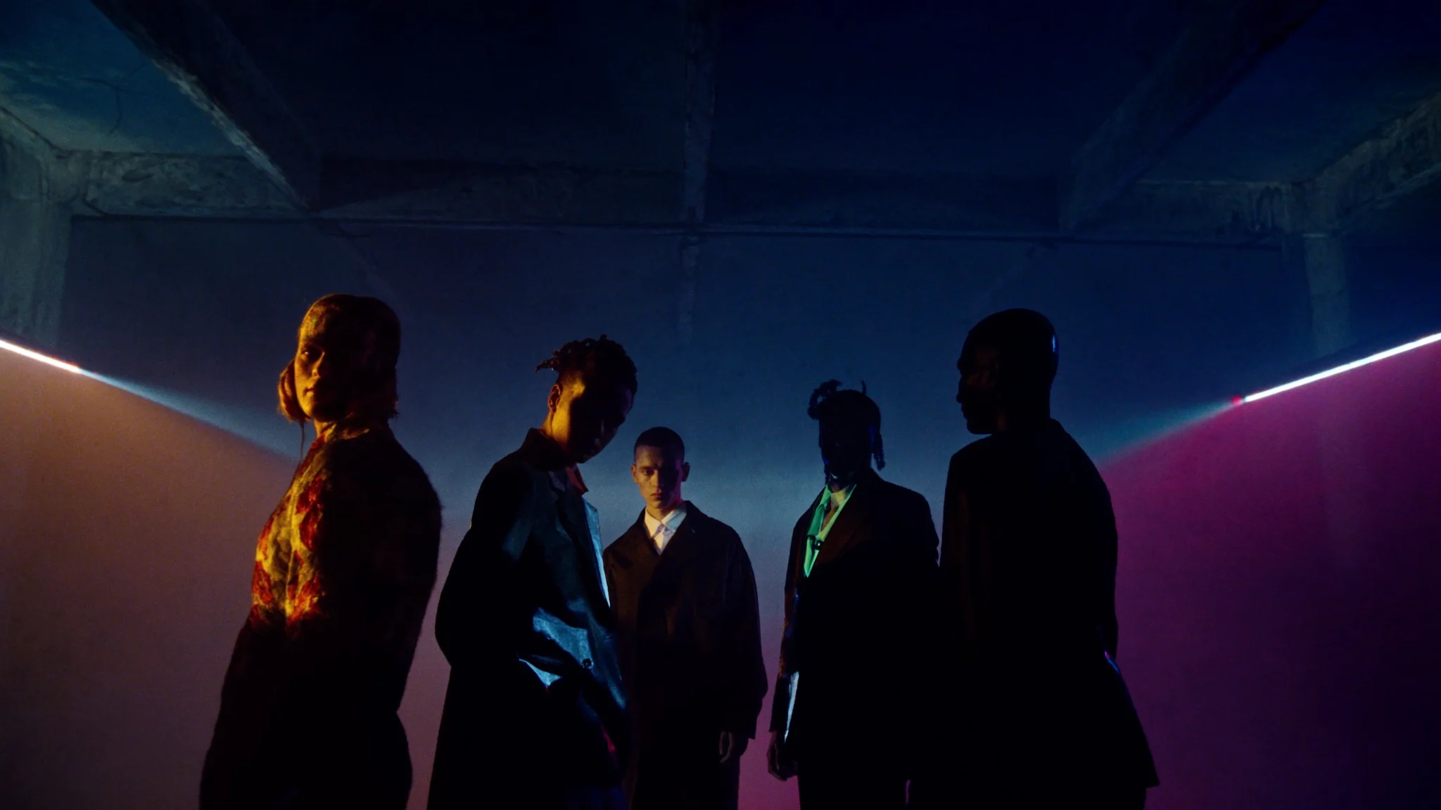 A curated ensemble of AI directors lit by cyan and magenta prism beams